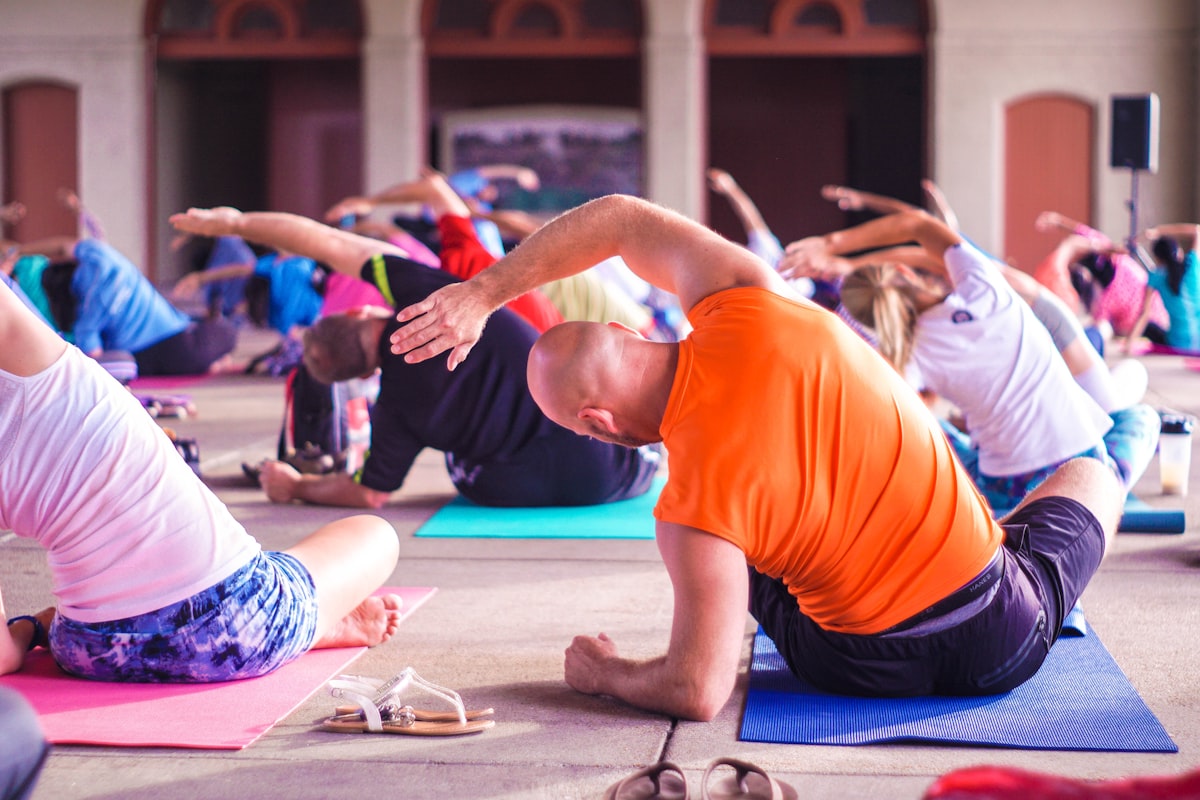 Active senior performing gentle yoga movement